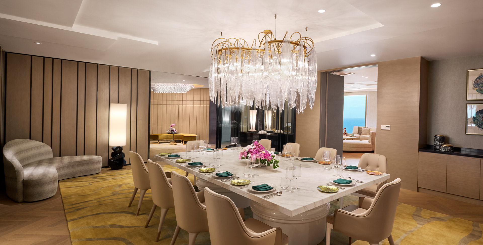 The Presidential Suite dining room, a long table under a crystal chandelier